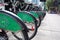 Closeup of bikes parked on a street in downtown Toronto, as part of the Toronto Bike Share program