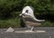 Closeup of a bird, part of `Waiting on the Train`, a Traveling Man stainless steel sculpture, Dallas, Texas