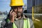 closeup of black man civil engineer at the construction site talking on the phone