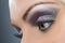 Closeup of black and purple glittery smokey eye
