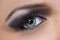 Closeup of black and purple glittery smokey eye