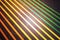 Closeup on black tile floor and parallel colorful strips.