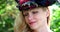 Closeup blond woman with historic costume with hat blue eyes blond hair