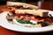 closeup of a blt sandwich with ample amount of mayonnaise