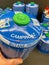 Closeup of blue camping campingaz butane propane gas cylinders in shelf of german supermarket
