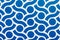 Closeup of a blue and white rotating pattern on the wall