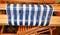 Closeup of Blue and white striped warp on back beam. Weaving. Handweaving. Textiles. Fiber.