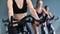 Closeup body of female cycling instructor during workout class. Shot on RED Raven 4k Cinema Camera