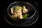 closeup boiled meat dumplings with salad in deep bowl