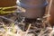 A closeup of a boiling pot on a gas primus cooking dinner for hikers.