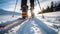 Closeup on a boot and a ski during the ski touring adventure.