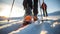 Closeup on a boot and a ski during the ski touring adventure.