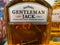 Closeup of bottle label Jack Daniels Gentleman whiskey in shelf of german supermarket
