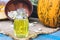 Closeup of a bottle of pumpkin seed essential oil on a napkin with burlap