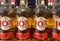 Closeup of bottles with logo lettering of osborne 103 brandy in shelf of german supermarket