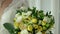 Closeup bouquet of roses and flowers with lemon close-up with a blur effect. Media. A combination of fruits and flowers