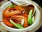 Closeup of a bowl of Chinese Drunken prawns food with spoon