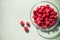 Closeup of bowl of fresh and ripe rasberries on pastel surface.Copy space.rasberry in glass bowl isolated. natural food