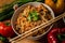 Closeup of a bowl of semolina with meat surrounded with vegetables on the table