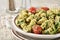 Closeup of a bowl of spinach pasta salad