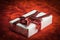 Closeup.boxes with gifts with ribbon . on red