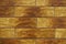 Closeup of brick-like brown embossed ceramic tiles siding