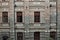 closeup of brick walk and windows of an old  historic factory