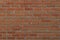 Closeup of a brick wall seamless texture, red pattern