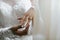 Closeup of a bride displaying her diamond engagement ring.