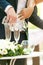 Closeup of bride and groom doing sand ceremony