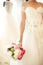 Closeup of the bride holding a wedding bouquet