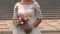 Closeup Bride in Long Dress Stands at Opera Theatre Entrance