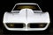 Closeup of a bright white drag racing car with a black racing stripe tinted headlights and glossy bumpers. Speed drive