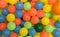 closeup of brightly colored plastic ballsin a childs play ball-pit