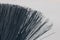 A closeup of a bristle brush. The texture of thin plastic rods. Graphic black lines.