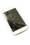 Closeup broken touch screen of white smart phone.