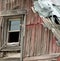 Closeup of Broken Window on a Weathered Barn