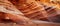 Closeup of brown bedrock outcrop in desert landscape