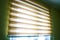 Closeup brown color Roller blinds curtains. sunlight through the windows and roller blind in the city. Soft focus image