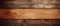 Closeup of a brown hardwood plank on a varnished wood wall