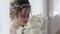 Closeup brunette bride with fashion wedding hairstyle and makeup