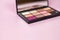 Closeup Brush with Eyeshadow Palette. Pink Nude Colors Eyeshadow. Professional make up.