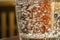 Closeup bubbles in glass of water liquid with warm colors