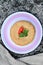 closeup the bunch brown color frayed tortilla with red chilly , green mint in the plastic plate with grey cloth soft focus natural