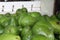 Closeup of bunch of fresh green avocados in traditional markets