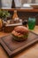 A closeup of burger on a wooden tray