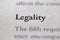 Closeup of Business legal term Legality printed in textbook on white page.