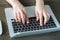 Closeup of business woman hand typing on laptop keyboar