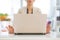Closeup on business woman meditating near laptop