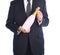 Closeup of a businessman in a gray suit holding a pink bottle of Champagne in front of his body - man is unrecognizable